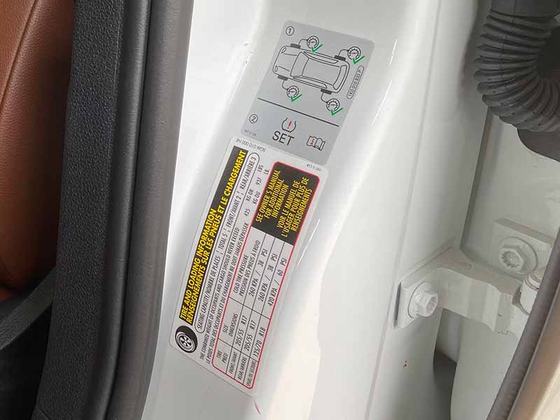 recommended tire pressure sticker in driver's door jam