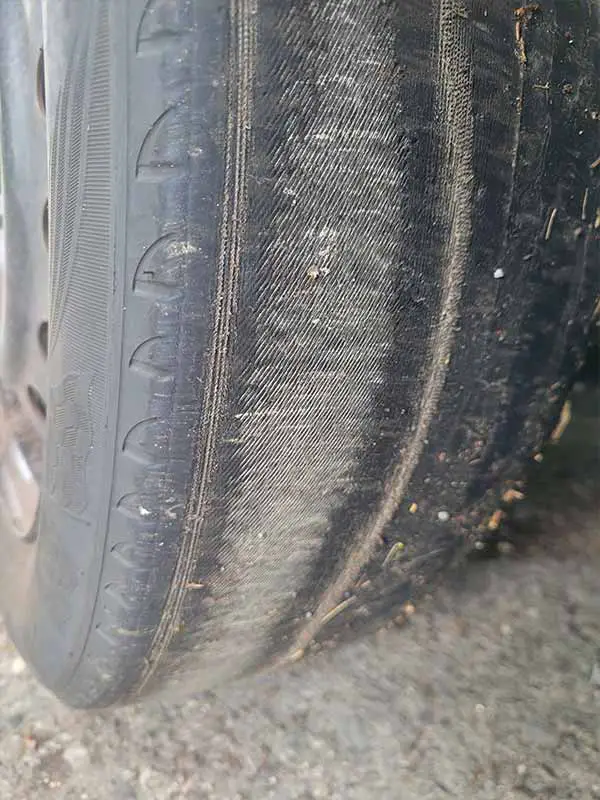 cords showing - bald tire