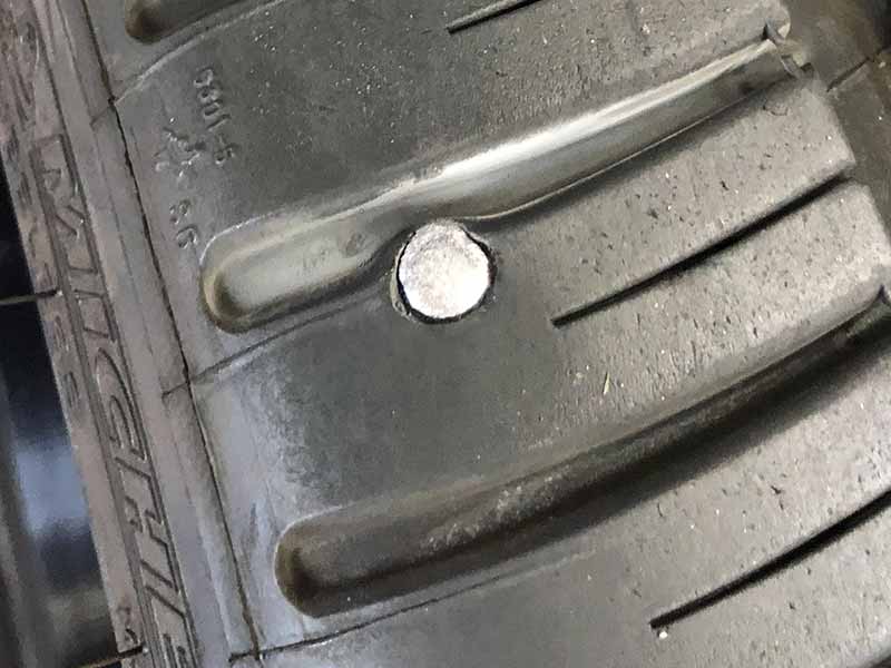tire with nail in shoulder area