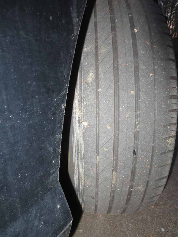 bald tire with cords showing